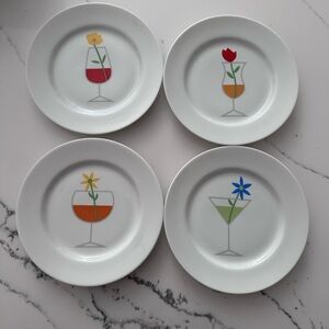 CRATE & BARREL set of 4 appetizer plates w/ wine/martini & flower decorations.